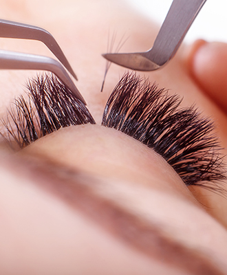 Eyelash Extension Procedure. Woman Eye with Long Eyelashes. Lashes. Close up, macro, selective focus